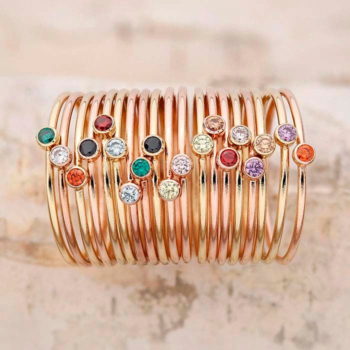 Pierścionek z różowym cyrkoniowym oczkiem, pozłacany żółtym złotem 14/20